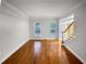 Bright living room with hardwood floors and staircase at 1512 Maplewood Ct, Woodstock, GA 30189