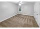 Spacious bedroom with neutral walls and carpeting at 1512 Maplewood Ct, Woodstock, GA 30189