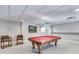 Basement game room featuring a pool table and comfortable seating at 8561 Lake Forrest Dr, Douglasville, GA 30134