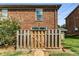 Private patio with wooden fence and gate at 5696 Kingsport Dr # 3, Atlanta, GA 30342