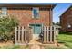 Small patio with wooden fence and sliding glass door access at 5696 Kingsport Dr # 3, Atlanta, GA 30342