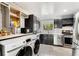 Updated kitchen features stainless steel appliances and washer-dryer in the unit at 5696 Kingsport Dr # 3, Atlanta, GA 30342