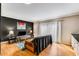 Living room features hardwood floors, a comfy couch, and an accent wall at 5696 Kingsport Dr # 3, Atlanta, GA 30342