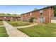 Brick building with private fenced patio and grassy backyard at 5696 Kingsport Dr # 3, Atlanta, GA 30342