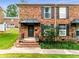 Brick front exterior of home with steps and landscaping at 5696 Kingsport Dr # 3, Atlanta, GA 30342
