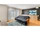 Cozy living room with built-in storage, hardwood floors, and access to a patio at 5696 Kingsport Dr # 3, Atlanta, GA 30342