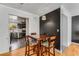 Small dining area with four chairs and view into the kitchen at 5696 Kingsport Dr # 3, Atlanta, GA 30342
