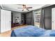 Bright bedroom with wood floors and a ceiling fan at 5696 Kingsport Dr # 3, Atlanta, GA 30342