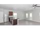 Open kitchen with island and stainless steel appliances at 10922 Wheeler Trce, Hampton, GA 30228