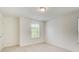 Spacious bedroom with window, carpet, and neutral walls at 550 Constellation Overlook Sw, Atlanta, GA 30331