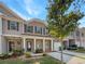 Two-story townhome with brick facade and landscaped yard at 1861 Old Dogwood, Jonesboro, GA 30238