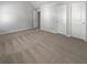 Spacious bedroom with neutral carpeting and ample closet space at 1861 Old Dogwood, Jonesboro, GA 30238