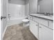 Bathroom with tub shower combo and white cabinets at 1861 Old Dogwood, Jonesboro, GA 30238