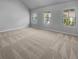 Large main bedroom with neutral carpeting and multiple windows at 1861 Old Dogwood, Jonesboro, GA 30238
