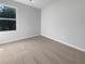 Well lit bedroom with neutral carpet and large window at 1861 Old Dogwood, Jonesboro, GA 30238