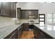 Modern kitchen with granite countertops and dark cabinetry at 2373 Bouldercliff Se Way, Atlanta, GA 30316