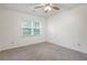 Bright bedroom with neutral carpeting and a ceiling fan at 2032 Sumter Ct, Lawrenceville, GA 30044