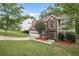 Two-story house with brick and siding, attached garage, and landscaped lawn at 721 Simon Park Cir, Lawrenceville, GA 30045