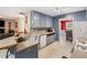 Kitchen features gray cabinets and a view into the dining area at 721 Simon Park Cir, Lawrenceville, GA 30045