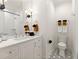 Stylish bathroom with white vanity, hexagon tile floor, and updated fixtures at 4391 Blackland Ne Dr, Marietta, GA 30067