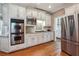 Spacious kitchen with stainless steel appliances and hardwood floors at 1372 Downington Nw Ln, Acworth, GA 30101