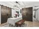 Dining area with rustic barn doors and chandelier at 3648 Peachtree Ne Rd # 1A, Atlanta, GA 30319