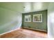 Light and airy bedroom with hardwood floors and two windows at 3664 Broadview Ct, Decatur, GA 30032