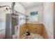 Small laundry room with a water heater and shelving at 3664 Broadview Ct, Decatur, GA 30032