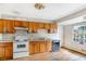 Kitchen with wood cabinets, appliances, and hardwood floors at 3664 Broadview Ct, Decatur, GA 30032
