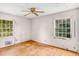 Bedroom with hardwood floors, ceiling fan, and dual windows at 3664 Broadview Ct, Decatur, GA 30032
