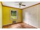 Bright bedroom with hardwood floors and a ceiling fan at 3664 Broadview Ct, Decatur, GA 30032