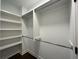 Bright walk-in closet featuring shelves and hanging space at 4085 Longleaf Ln, Tucker, GA 30084