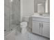 Bathroom with toilet and marble-tiled shower at 4085 Longleaf Ln, Tucker, GA 30084