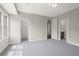 Spacious bedroom with gray carpet, lots of natural light, and en-suite bathroom at 4085 Longleaf Ln, Tucker, GA 30084