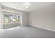 Well-lit bedroom featuring gray carpeting and a bay window at 4085 Longleaf Ln, Tucker, GA 30084
