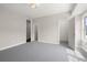 Spacious bedroom with gray carpet and two windows at 4085 Longleaf Ln, Tucker, GA 30084