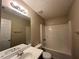 Bathroom with tub, shower, and single vanity at 317 Shasta Ln, Mcdonough, GA 30253