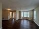 Spacious living room featuring hardwood floors and bay windows at 317 Shasta Ln, Mcdonough, GA 30253