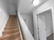 Upstairs hallway with staircase and doors at 57 Westend Way, Hiram, GA 30141