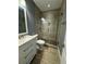 Updated bathroom with a walk-in shower and modern vanity at 739 Bayliss Dr, Marietta, GA 30068