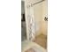 Walk-in shower with a patterned shower curtain and grab bar at 595 Huiet Dr, Mcdonough, GA 30252