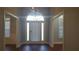 Bright entryway with hardwood floors and an arched doorway at 595 Huiet Dr, Mcdonough, GA 30252