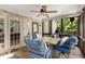 Relaxing screened porch with a table, chairs, and string lights at 1028 Longwood Dr, Woodstock, GA 30189