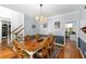 Bright dining room with hardwood floors and view of kitchen at 1028 Longwood Dr, Woodstock, GA 30189