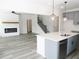Modern kitchen with gray cabinets, quartz countertops, and stainless steel appliances at 3301 Pepperpike Ct, Loganville, GA 30052