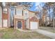 Attractive brick front exterior of a townhouse with garage at 5100 Windsor Forrest Ln, Atlanta, GA 30349