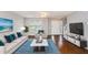 Spacious living room with hardwood floors and comfy furniture at 705 Chase Ln, Mcdonough, GA 30253