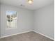 Simple bedroom with neutral walls and carpeted floors at 705 Chase Ln, Mcdonough, GA 30253