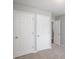 Bedroom with two closets and neutral decor at 705 Chase Ln, Mcdonough, GA 30253