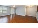 Open living room featuring hardwood floors and lots of natural light at 705 Chase Ln, Mcdonough, GA 30253